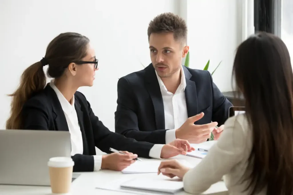Medical treatment and decision making Lawyers discussing legal matters with a client during a professional consultation meeting.